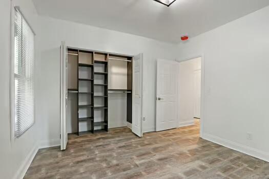 1107 Perry Ave, Racine, WI 53406 - unfurnished bedroom featuring baseboards