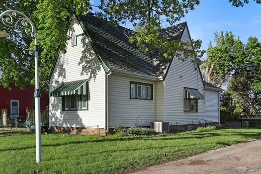 1107 Perry Ave, Racine, WI 53406 - view of home's exterior featuring a lawn and cooling unit