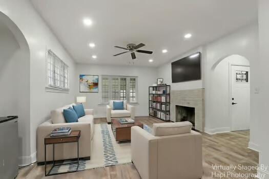 1107 Perry Ave, Racine, WI 53406 - living area with ceiling fan, a fireplace, light wood-style flooring, recessed lighting, and healthy amount of natural light