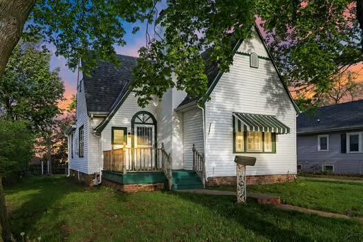 1107 Perry Ave, Racine, WI 53406 - rear view of house with a lawn