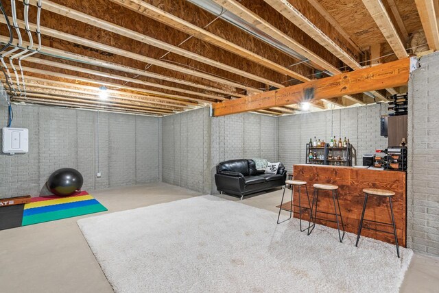 160 Candleberry Ln, Grafton, WI 53024 - unfinished basement featuring a bar and brick wall