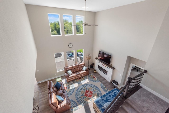 160 Candleberry Ln, Grafton, WI 53024 - living room with a high ceiling, baseboards, a ceiling fan, and wood finished floors