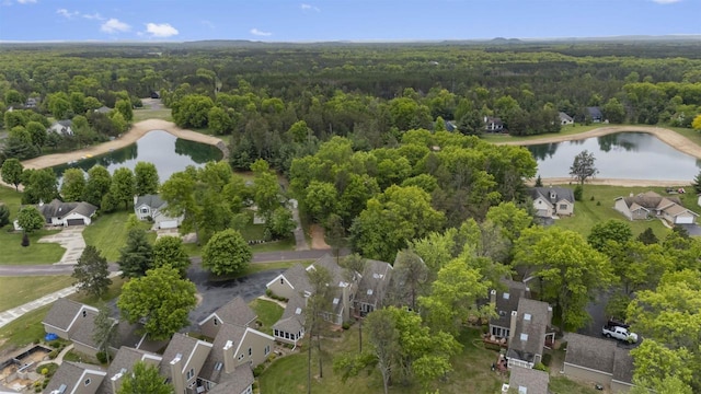 W5204 N Osprey Dr, New Lisbon, WI 53950 - aerial view of property's location featuring a heavily wooded area, a nearby body of water, and nearby suburban area