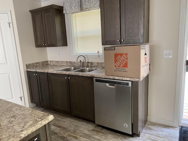 32793 Fulton St, Gotham, WI 53540 - kitchen with dishwasher, a sink, dark brown cabinetry, light wood-type flooring, and light countertops