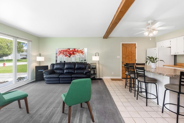 357 W Sugar Ln, Glendale, WI 53217 - living room featuring a ceiling fan, baseboards, light tile patterned floors, and beamed ceiling