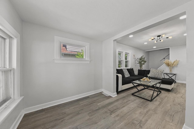6028 N 38th St, Milwaukee, WI 53209 - living area featuring wood finished floors, baseboards, recessed lighting, and a chandelier