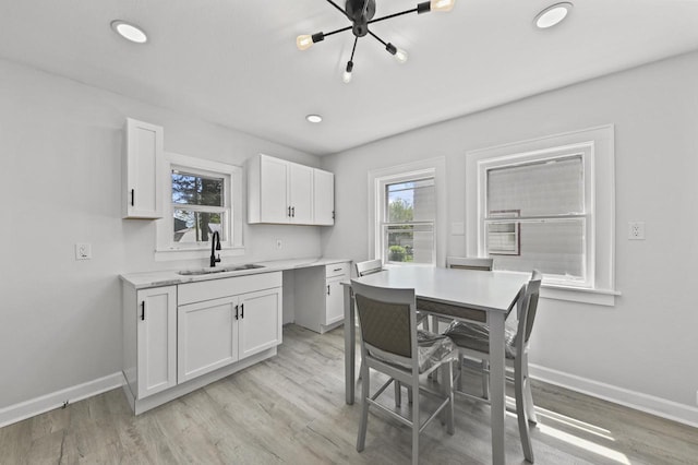 6028 N 38th St, Milwaukee, WI 53209 - dining space with light wood-type flooring, baseboards, and recessed lighting