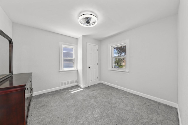 6028 N 38th St, Milwaukee, WI 53209 - empty room with baseboards and carpet floors