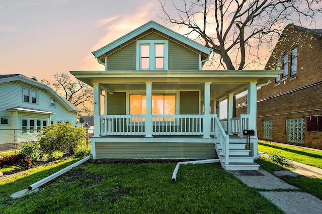 1632 S 77th St, West Allis, WI 53214 - view of front facade with a porch and a front yard