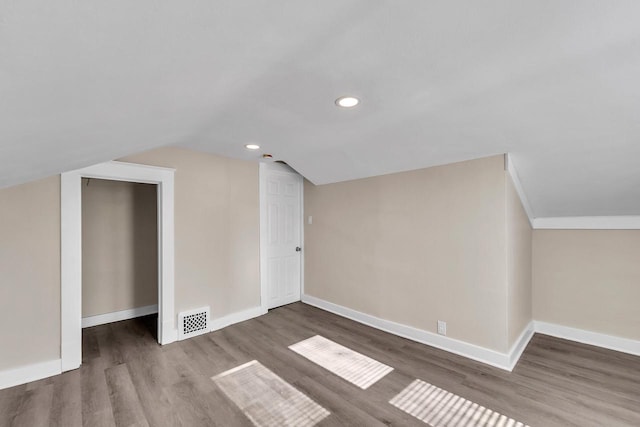 1632 S 77th St, West Allis, WI 53214 - bonus room featuring baseboards, wood finished floors, lofted ceiling, and recessed lighting