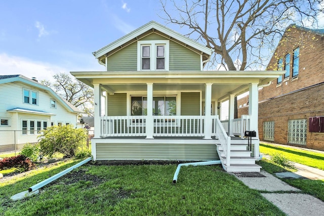 1632 S 77th St, West Allis, WI 53214 - view of front of house with covered porch and a front yard