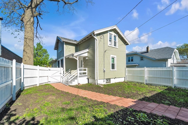 1632 S 77th St, West Allis, WI 53214 - rear view of property with a fenced backyard and a gate