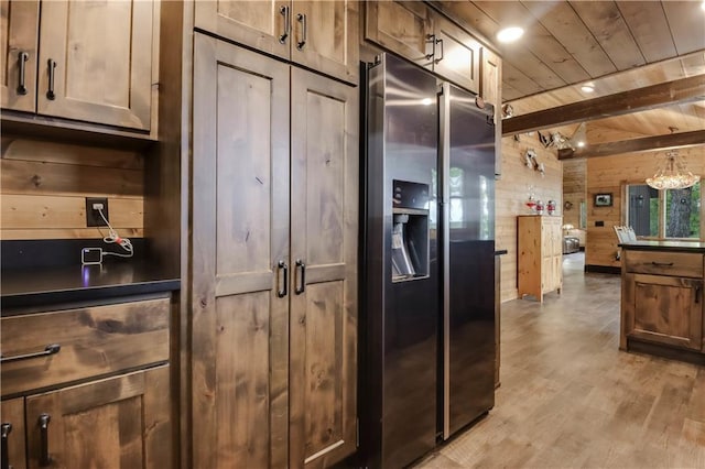 14856W Valhalla Dr, Hayward, WI 54843 - kitchen featuring stainless steel refrigerator with ice dispenser, wooden walls, wood ceiling with exposed beams, light wood-style floors, and recessed lighting