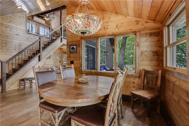 14856W Valhalla Dr, Hayward, WI 54843 - dining space with wooden ceiling, wooden walls, wood finished floors, stairs, and high vaulted ceiling