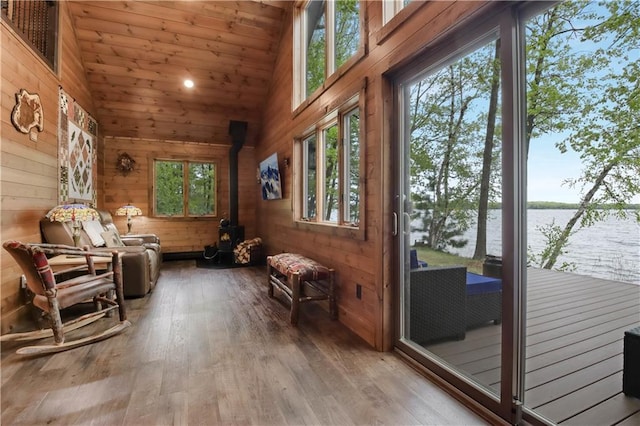 14856W Valhalla Dr, Hayward, WI 54843 - sunroom / solarium with vaulted ceiling, a water view, and a wood stove