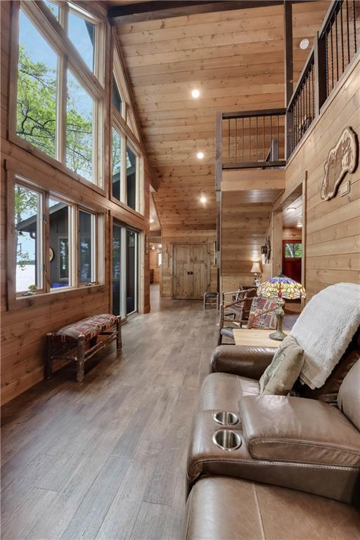 14856W Valhalla Dr, Hayward, WI 54843 - living room with high vaulted ceiling, wood ceiling, wooden walls, wood-type flooring, and recessed lighting
