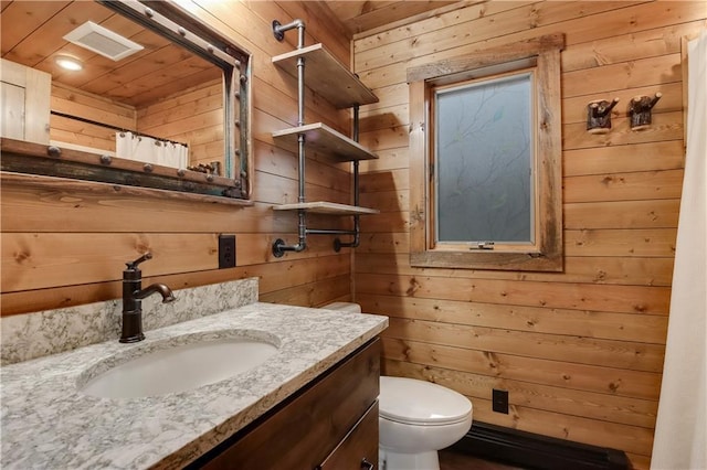 14856W Valhalla Dr, Hayward, WI 54843 - full bath with wooden walls, vanity, toilet, and a shower with curtain