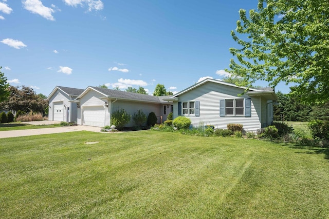 W5670 School Rd, Walworth, WI 53184 - ranch-style house featuring a front yard, concrete driveway, and an attached garage