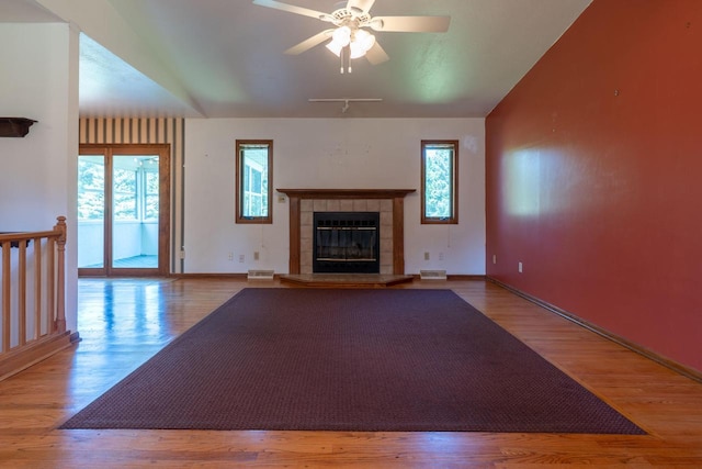 W5670 School Rd, Walworth, WI 53184 - unfurnished living room featuring plenty of natural light, wood finished floors, and lofted ceiling