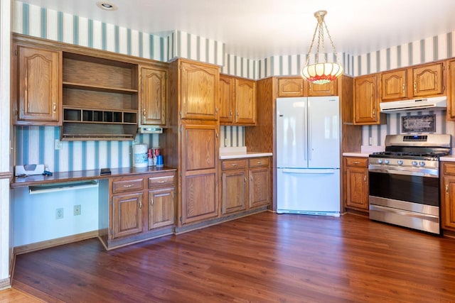W5670 School Rd, Walworth, WI 53184 - kitchen with freestanding refrigerator, gas range, wallpapered walls, under cabinet range hood, and brown cabinetry