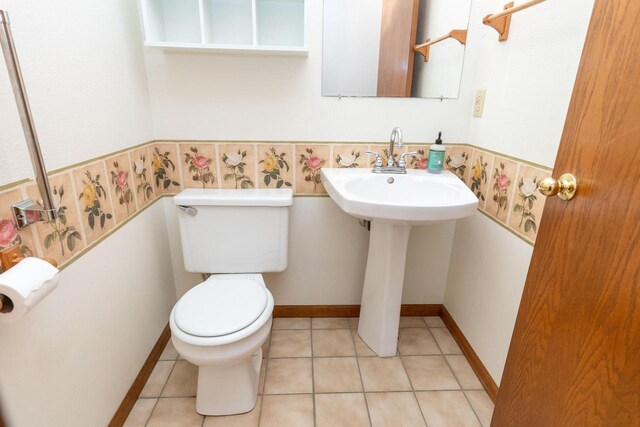 W5670 School Rd, Walworth, WI 53184 - half bathroom with toilet and tile patterned floors