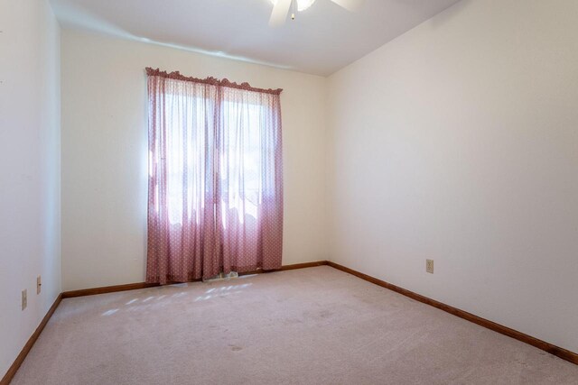 W5670 School Rd, Walworth, WI 53184 - unfurnished room featuring carpet flooring, ceiling fan, and baseboards