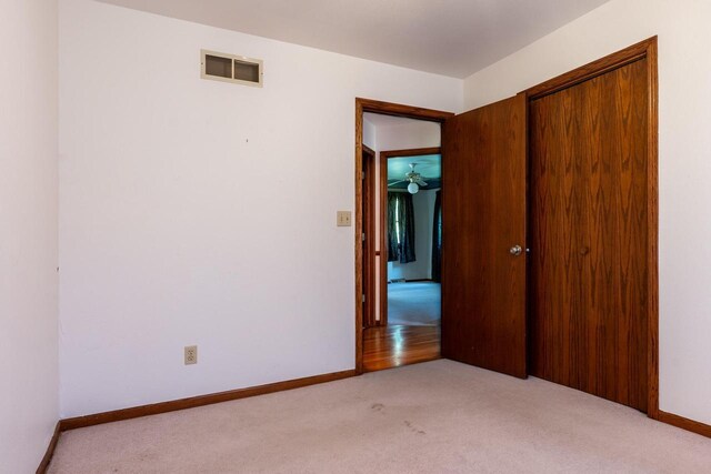 W5670 School Rd, Walworth, WI 53184 - spare room with light carpet and baseboards