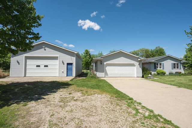 W5670 School Rd, Walworth, WI 53184 - single story home featuring a detached garage and a front yard