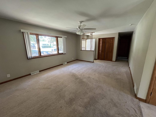 425 Mineau Pkwy, Madison, WI 53711 - unfurnished bedroom with light carpet, baseboards, and a ceiling fan