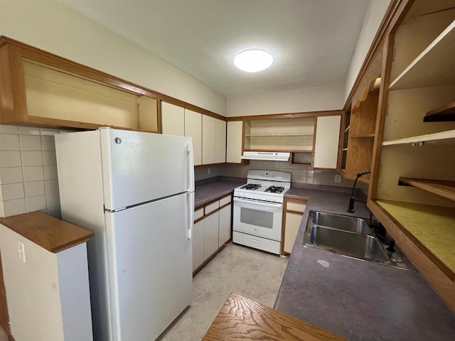 425 Mineau Pkwy, Madison, WI 53711 - kitchen featuring white appliances, under cabinet range hood, open shelves, dark countertops, and a sink