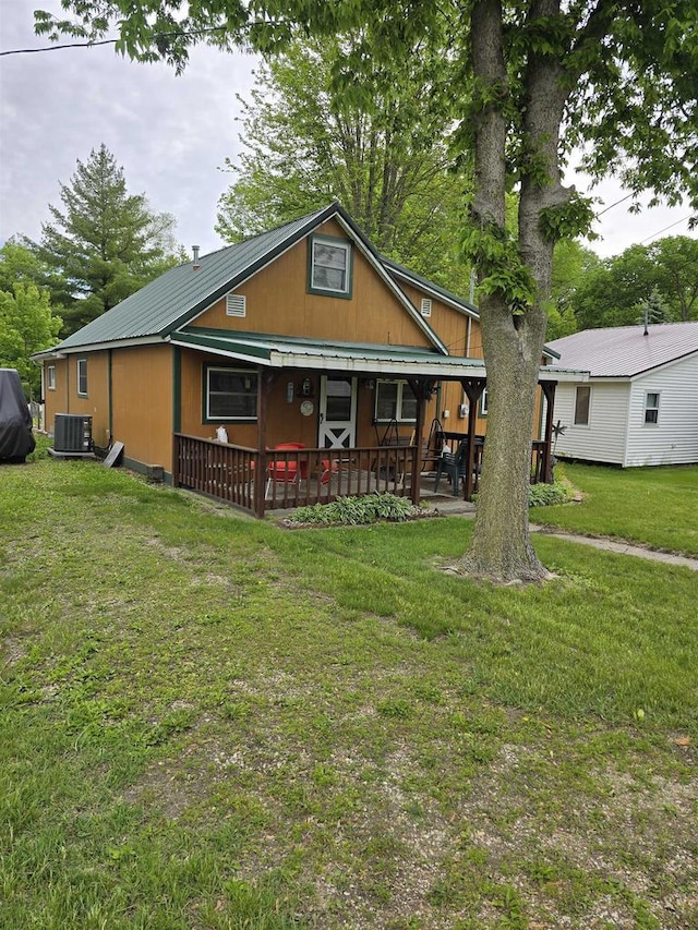 Pine Ln, Bloomington, WI 53804 - back of property featuring metal roof, central AC, and a lawn