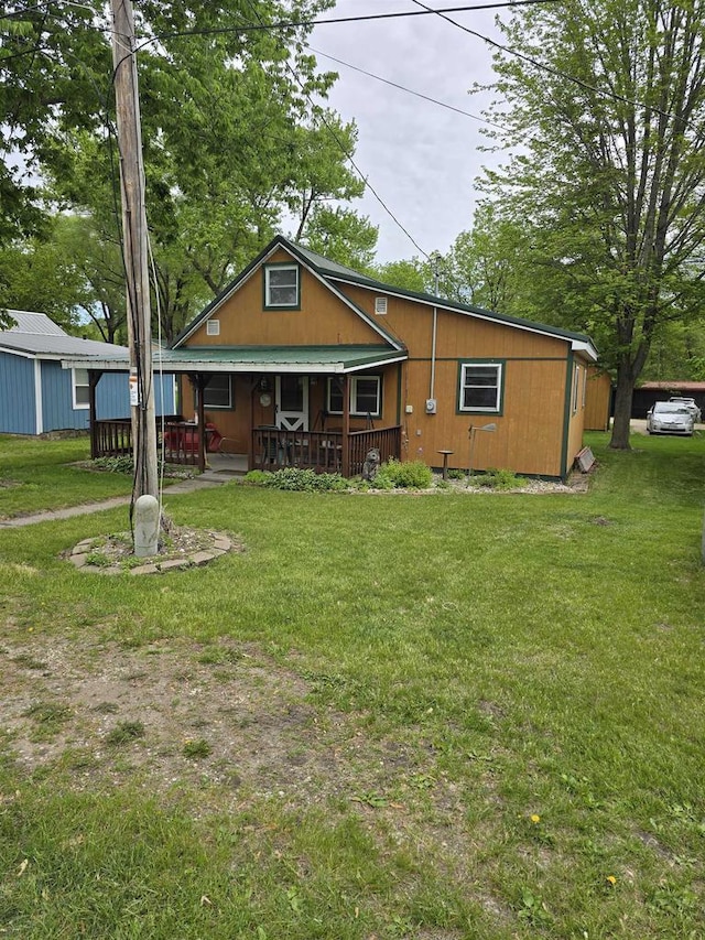Pine Ln, Bloomington, WI 53804 - view of front of home featuring covered porch, a front yard, and metal roof