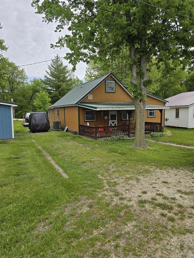 Pine Ln, Bloomington, WI 53804 - bungalow-style house featuring central AC, metal roof, a front lawn, and a porch