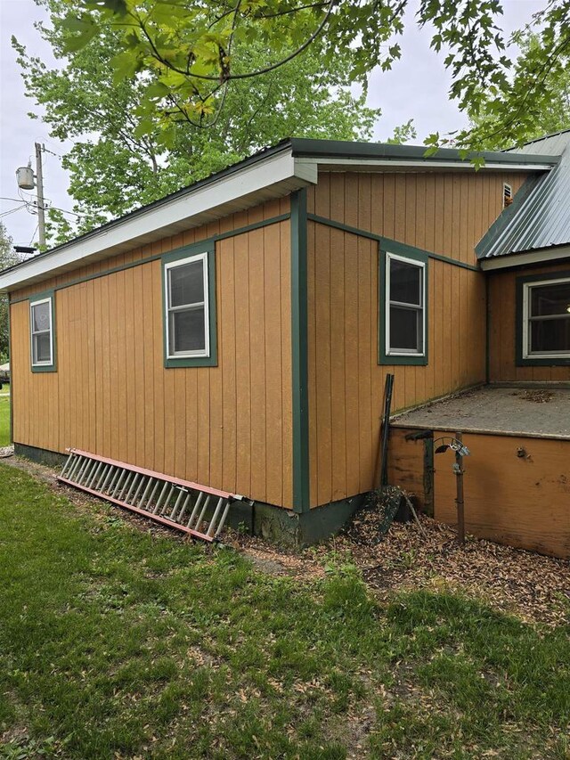 Pine Ln, Bloomington, WI 53804 - view of side of home featuring a lawn and metal roof
