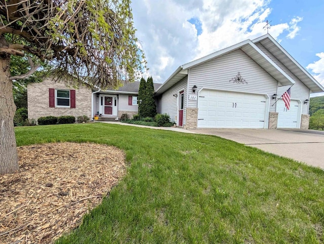 151 Mcintosh Ct, Gays Mills, WI 54631 - single story home featuring brick siding, an attached garage, a front yard, and concrete driveway