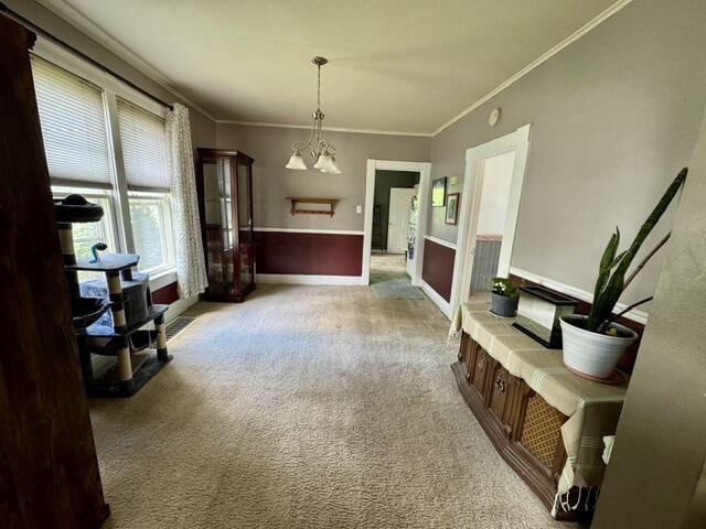 219 E 9th St, Fond Du Lac, WI 54935 - dining space featuring light colored carpet, crown molding, and baseboards