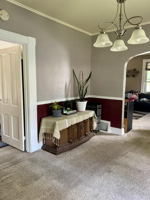 219 E 9th St, Fond Du Lac, WI 54935 - interior space with carpet, arched walkways, and ornamental molding