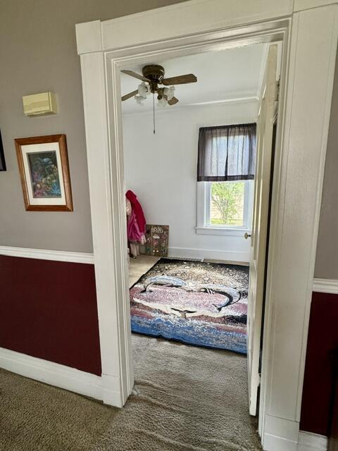 219 E 9th St, Fond Du Lac, WI 54935 - corridor with carpet and baseboards