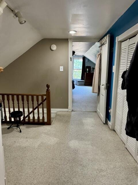 219 E 9th St, Fond Du Lac, WI 54935 - hallway with carpet floors, vaulted ceiling, and an upstairs landing