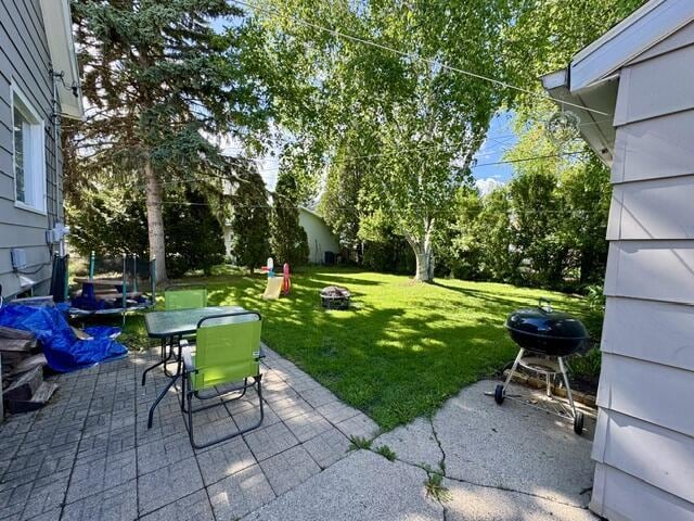219 E 9th St, Fond Du Lac, WI 54935 - view of patio / terrace with an outdoor fire pit, grilling area, and outdoor dining area