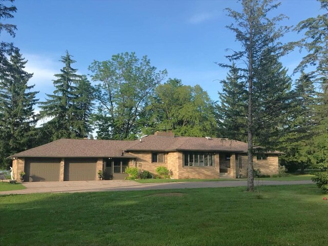 4211 State Highway 173, Nekoosa, WI 54457 - ranch-style house featuring an attached garage, a front yard, and driveway
