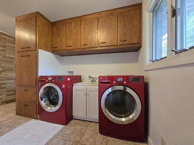 4211 State Highway 173, Nekoosa, WI 54457 - washroom with washer / clothes dryer, cabinet space, light tile patterned floors, and brick wall