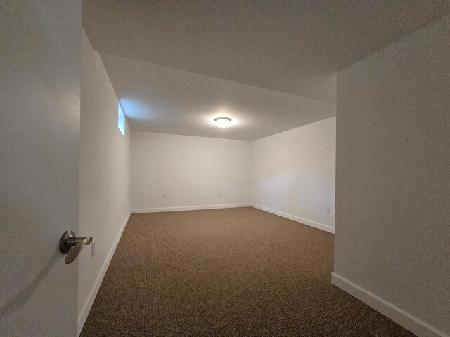 4211 State Highway 173, Nekoosa, WI 54457 - empty room featuring dark carpet and baseboards