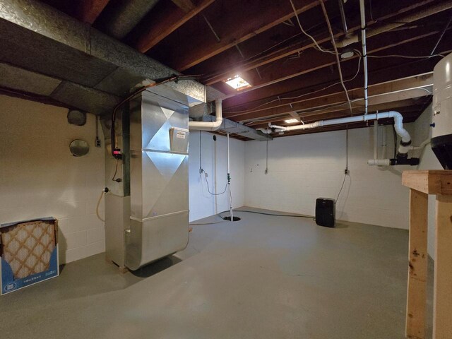 4211 State Highway 173, Nekoosa, WI 54457 - unfinished below grade area with heating unit and concrete block wall