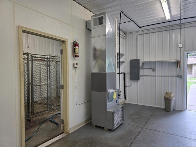 4211 State Highway 173, Nekoosa, WI 54457 - utility room featuring heating unit, electric panel, and a garage