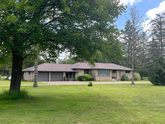 4211 State Highway 173, Nekoosa, WI 54457 - ranch-style house featuring an attached garage, stone siding, a front yard, and driveway