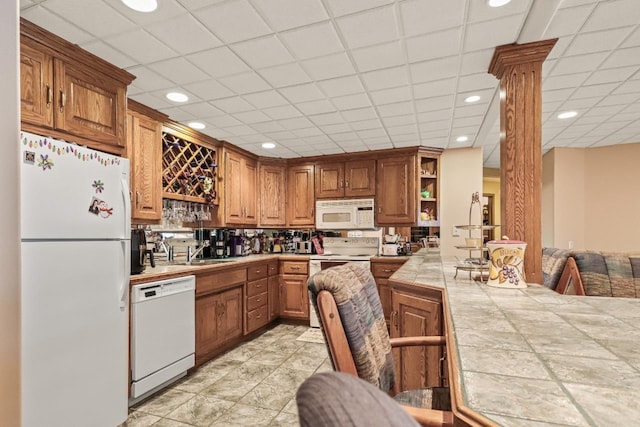 W11078 S Shore Rd, Deerbrook, WI 54425 - kitchen with white appliances, open shelves, a sink, brown cabinetry, and tile counters