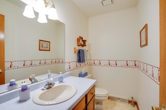 741 Kensington Sq, Stoughton, WI 53589 - half bathroom featuring toilet, vanity, and tile patterned flooring