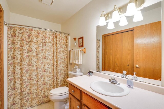 741 Kensington Sq, Stoughton, WI 53589 - bathroom with vanity, toilet, and a shower with curtain