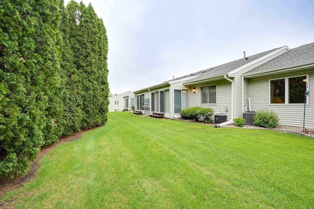 741 Kensington Sq, Stoughton, WI 53589 - view of green lawn with central AC unit